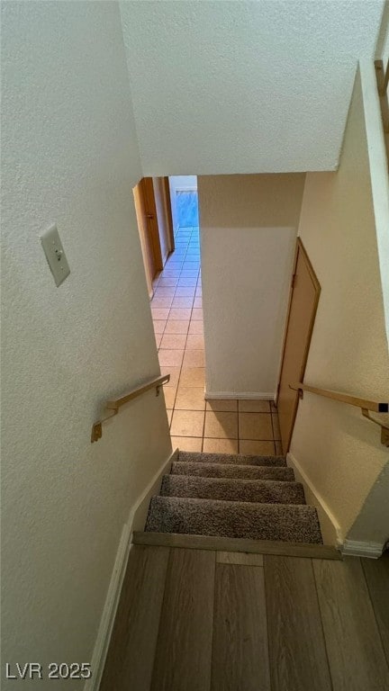 3412 Mercury St Unit I, North Las Vegas, NV 89030 - stairway featuring tile patterned flooring and baseboards