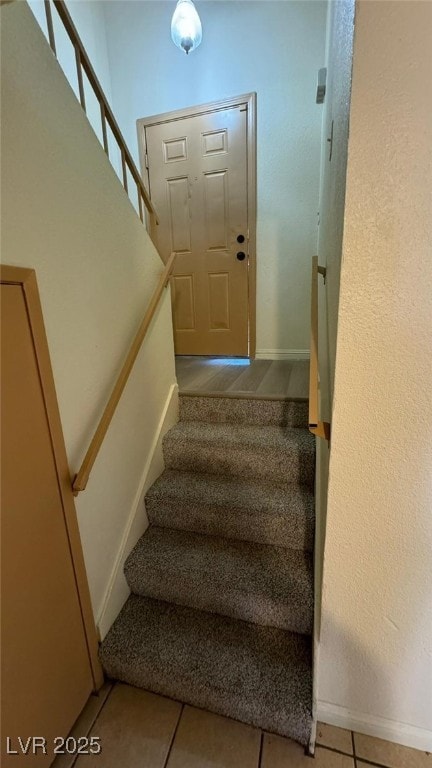 3412 Mercury St Unit I, North Las Vegas, NV 89030 - stairs featuring baseboards and tile patterned floors