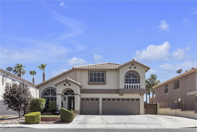 1877 Glory Lily Ct, Las Vegas, NV 89123 - mediterranean / spanish-style home featuring an attached garage, stucco siding, driveway, and a tile roof