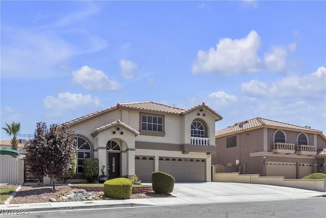 1877 Glory Lily Ct, Las Vegas, NV 89123 - mediterranean / spanish house with a garage, concrete driveway, stucco siding, and a tile roof
