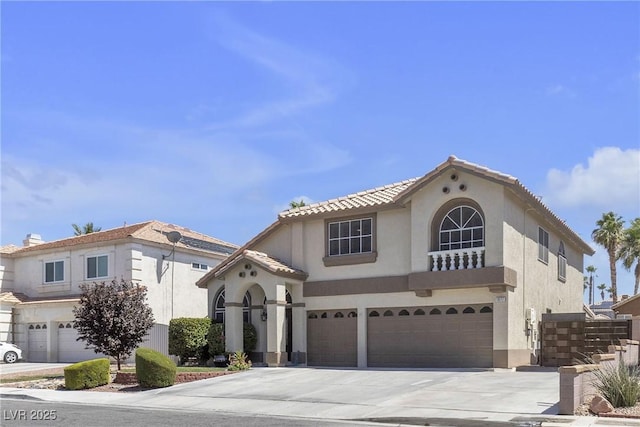 1877 Glory Lily Ct, Las Vegas, NV 89123 - mediterranean / spanish-style home with an attached garage, concrete driveway, stucco siding, and a tiled roof
