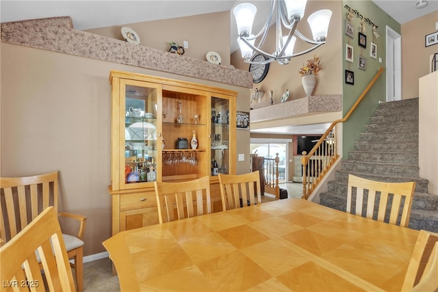 1877 Glory Lily Ct, Las Vegas, NV 89123 - dining room featuring a chandelier, stairs, and vaulted ceiling