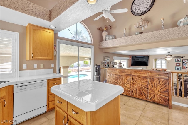 1877 Glory Lily Ct, Las Vegas, NV 89123 - kitchen featuring dishwasher, a ceiling fan, tile counters, and light tile patterned floors