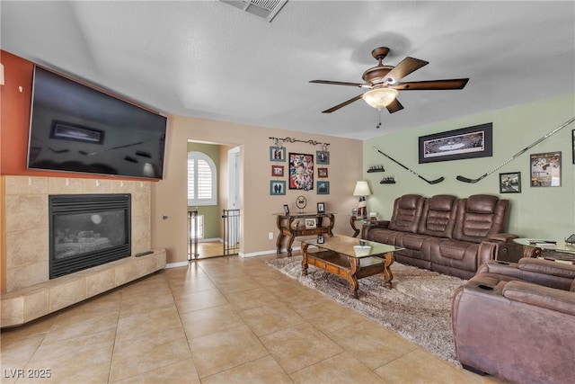 1877 Glory Lily Ct, Las Vegas, NV 89123 - living area featuring ceiling fan, tile patterned floors, and a tile fireplace