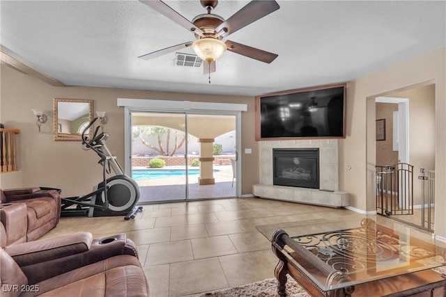 1877 Glory Lily Ct, Las Vegas, NV 89123 - living room featuring a ceiling fan and a tiled fireplace
