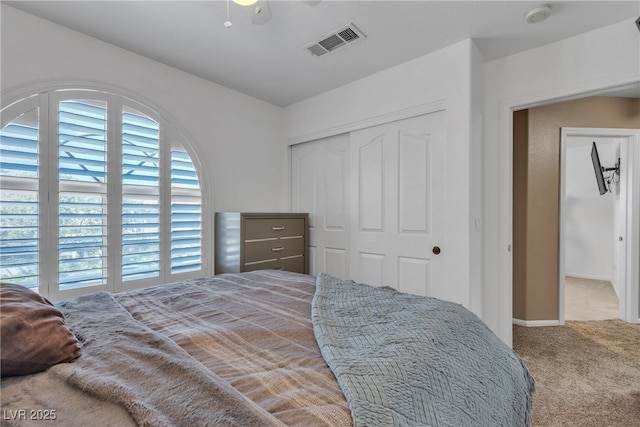 1877 Glory Lily Ct, Las Vegas, NV 89123 - carpeted bedroom with a closet and a ceiling fan