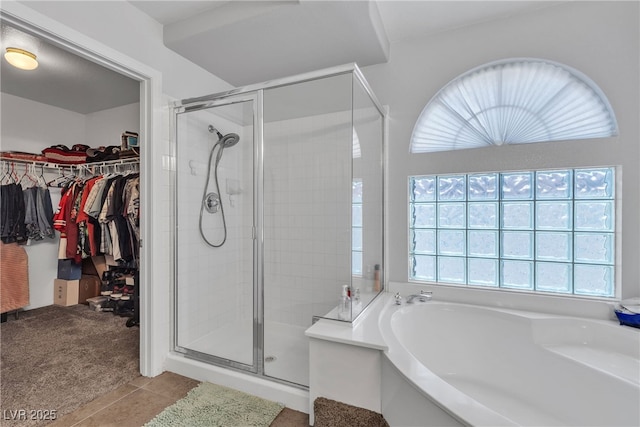 1877 Glory Lily Ct, Las Vegas, NV 89123 - full bath with a garden tub, a stall shower, a spacious closet, and tile patterned flooring