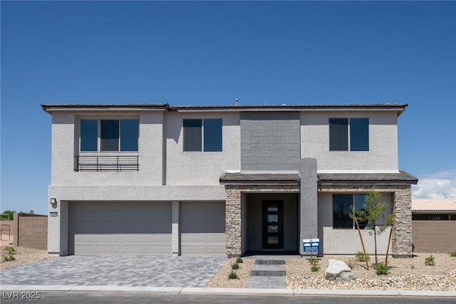 7199 Twilight Rider Ct, Las Vegas, NV 89118 - view of front of property featuring stucco siding, a garage, and decorative driveway