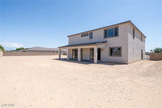 7199 Twilight Rider Ct, Las Vegas, NV 89118 - back of property featuring stucco siding and a patio area