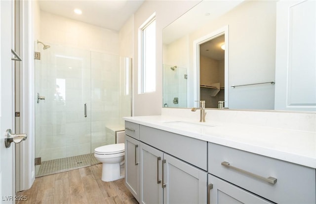 7199 Twilight Rider Ct, Las Vegas, NV 89118 - full bath with a shower stall, vanity, wood finished floors, a spacious closet, and recessed lighting
