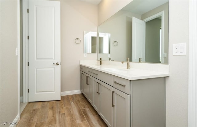 7199 Twilight Rider Ct, Las Vegas, NV 89118 - bathroom featuring double vanity and wood finished floors