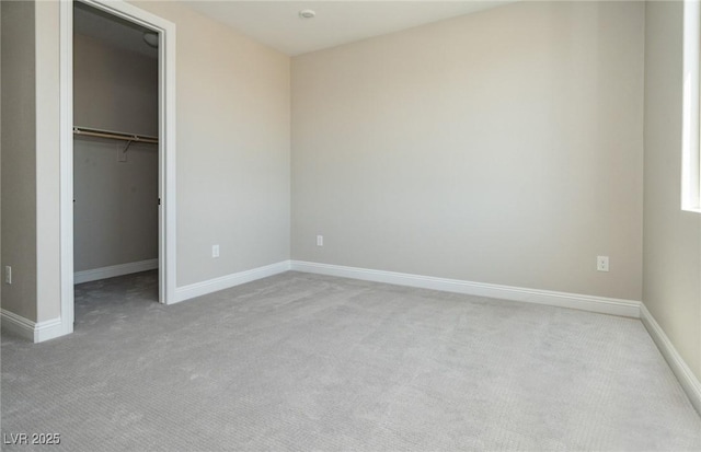 7199 Twilight Rider Ct, Las Vegas, NV 89118 - unfurnished bedroom with light colored carpet, a walk in closet, and a closet