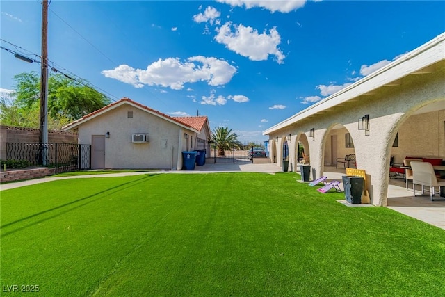 465 E Robindale Rd, Las Vegas, NV 89123 - view of yard featuring a patio area and a wall unit AC