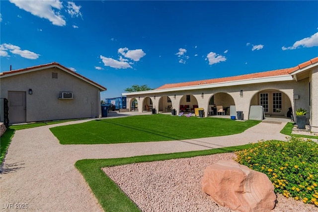 465 E Robindale Rd, Las Vegas, NV 89123 - back of house with stucco siding, a lawn, and a patio area