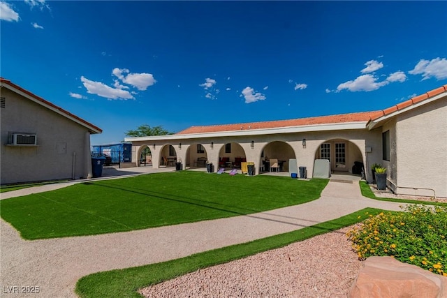 465 E Robindale Rd, Las Vegas, NV 89123 - rear view of house featuring stucco siding, a lawn, and a patio