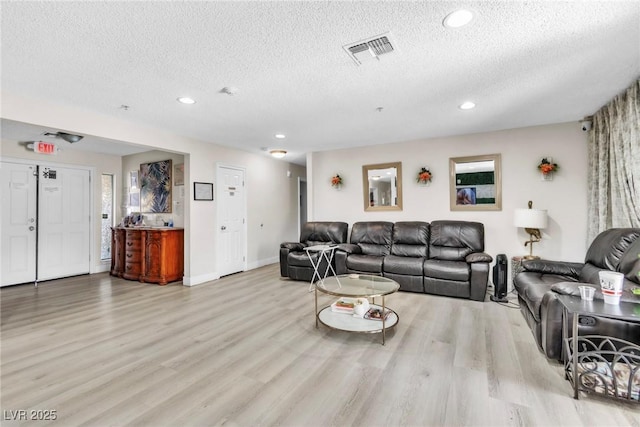 465 E Robindale Rd, Las Vegas, NV 89123 - living room featuring a textured ceiling, wood finished floors, and recessed lighting