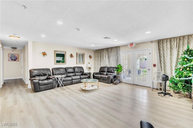 465 E Robindale Rd, Las Vegas, NV 89123 - living room with a textured ceiling, wood finished floors, recessed lighting, and french doors