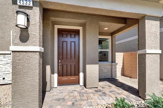 4533 Queens Hill St, North Las Vegas, NV 89031 - property entrance with stucco siding