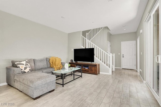 4533 Queens Hill St, North Las Vegas, NV 89031 - living area with stairway and light wood finished floors