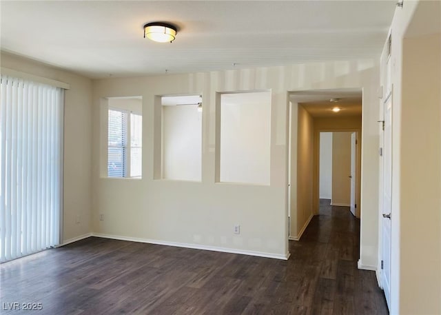 908 Duckhorn Ct Unit 102, Las Vegas, NV 89144 - spare room with dark wood-type flooring and baseboards