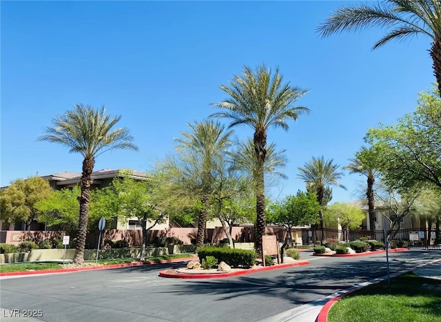 908 Duckhorn Ct Unit 102, Las Vegas, NV 89144 - view of asphalt street with curbs, a residential view, and traffic signs