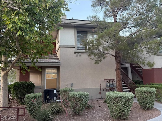 908 Duckhorn Ct Unit 102, Las Vegas, NV 89144 - view of front of house featuring stucco siding and stairs