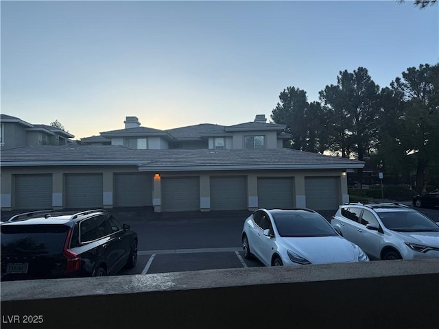 908 Duckhorn Ct Unit 102, Las Vegas, NV 89144 - prairie-style home with community garages and a chimney