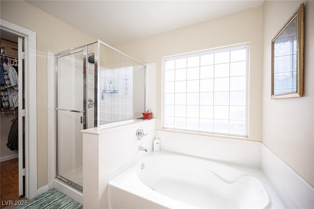 5600 Old Stable Ave, Las Vegas, NV 89131 - full bath with a garden tub, a walk in closet, and a stall shower
