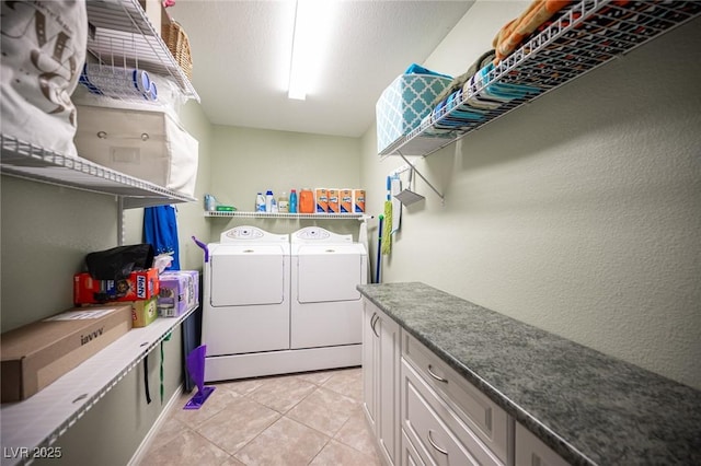 5600 Old Stable Ave, Las Vegas, NV 89131 - laundry room featuring washer and dryer, light tile patterned flooring, and a textured wall