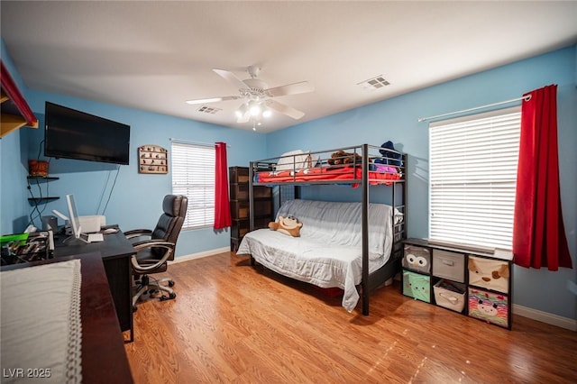 5600 Old Stable Ave, Las Vegas, NV 89131 - bedroom with wood finished floors, a desk, and ceiling fan