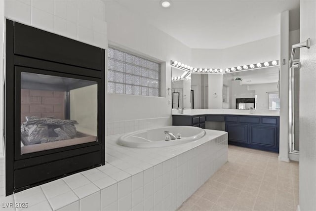 3632 Julia Waldene Ct, Las Vegas, NV 89129 - bathroom with a garden tub, vanity, a shower stall, and recessed lighting