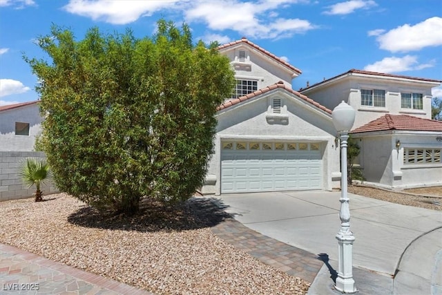 3632 Julia Waldene Ct, Las Vegas, NV 89129 - mediterranean / spanish-style home featuring concrete driveway, a garage, a tiled roof, and stucco siding
