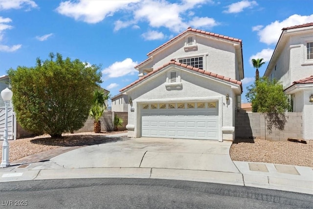 3632 Julia Waldene Ct, Las Vegas, NV 89129 - mediterranean / spanish house featuring a tiled roof, driveway, stucco siding, and an attached garage