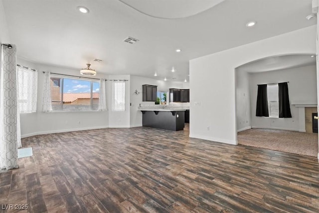 3632 Julia Waldene Ct, Las Vegas, NV 89129 - unfurnished living room featuring dark wood finished floors and recessed lighting
