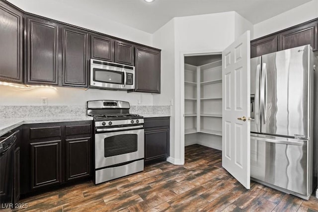 3632 Julia Waldene Ct, Las Vegas, NV 89129 - kitchen with appliances with stainless steel finishes, dark wood-type flooring, light stone counters, and dark brown cabinetry