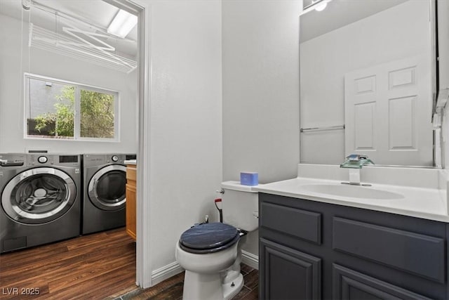 3632 Julia Waldene Ct, Las Vegas, NV 89129 - bathroom with washer and dryer, vanity, and wood finished floors