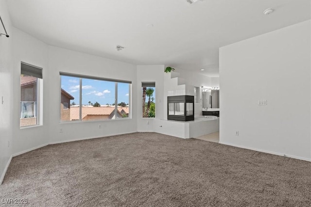 3632 Julia Waldene Ct, Las Vegas, NV 89129 - unfurnished living room featuring carpet flooring and baseboards
