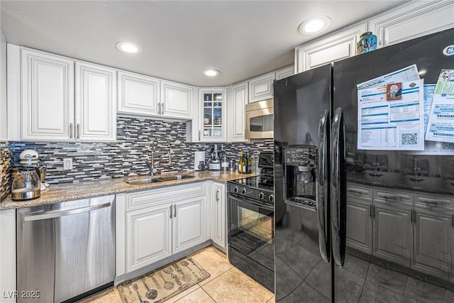 1001 Sulphur Springs Ln Unit 202, Las Vegas, NV 89128 - kitchen with stainless steel appliances, light tile patterned floors, white cabinets, tasteful backsplash, and recessed lighting