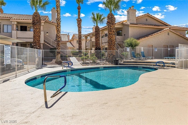 1001 Sulphur Springs Ln Unit 202, Las Vegas, NV 89128 - community pool with a patio area and a residential view