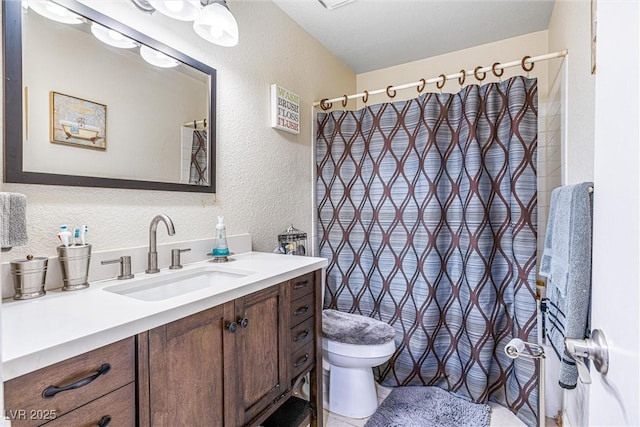 1001 Sulphur Springs Ln Unit 202, Las Vegas, NV 89128 - bathroom featuring a textured wall, vanity, and a shower with shower curtain