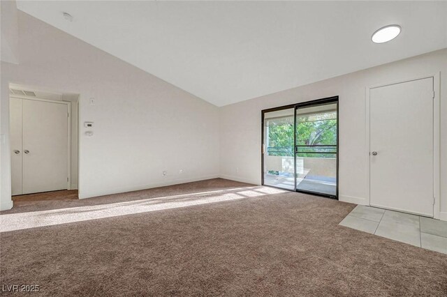 5161 Lindell Rd Unit 206, Las Vegas, NV 89118 - empty room with light carpet, lofted ceiling, and a smoke detector