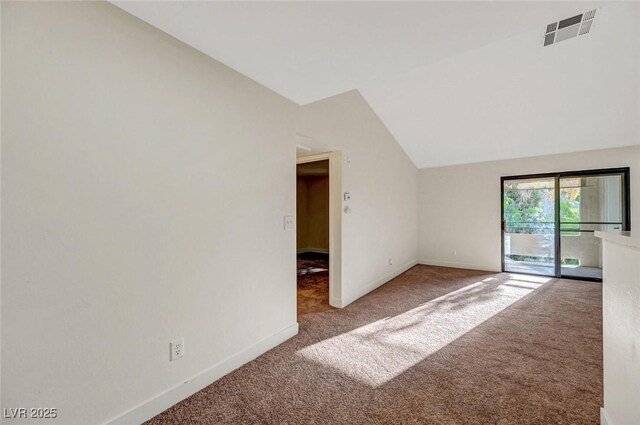 5161 Lindell Rd Unit 206, Las Vegas, NV 89118 - carpeted empty room with vaulted ceiling and baseboards