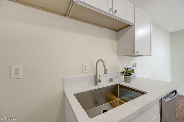 5161 Lindell Rd Unit 206, Las Vegas, NV 89118 - kitchen featuring light countertops, white cabinetry, and carpet