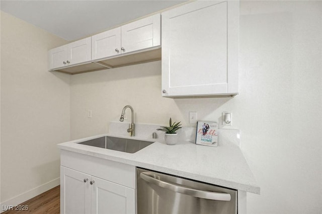 5161 Lindell Rd Unit 206, Las Vegas, NV 89118 - kitchen featuring dishwasher, white cabinets, and wood finished floors