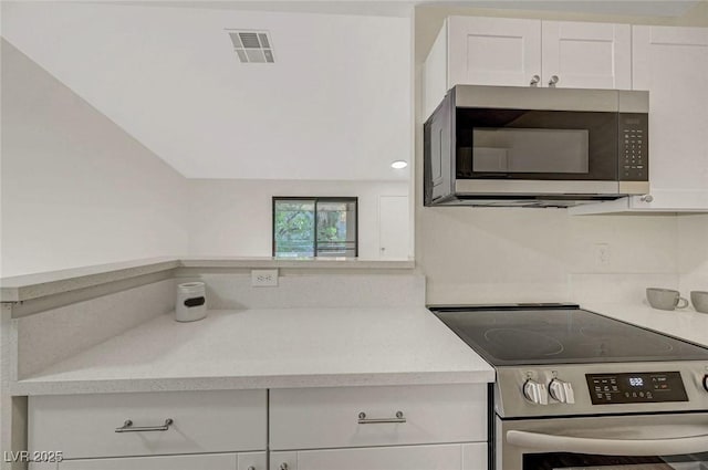 5161 Lindell Rd Unit 206, Las Vegas, NV 89118 - kitchen with appliances with stainless steel finishes, light countertops, and white cabinetry
