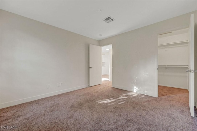 5161 Lindell Rd Unit 206, Las Vegas, NV 89118 - unfurnished bedroom featuring carpet flooring, a walk in closet, and a closet