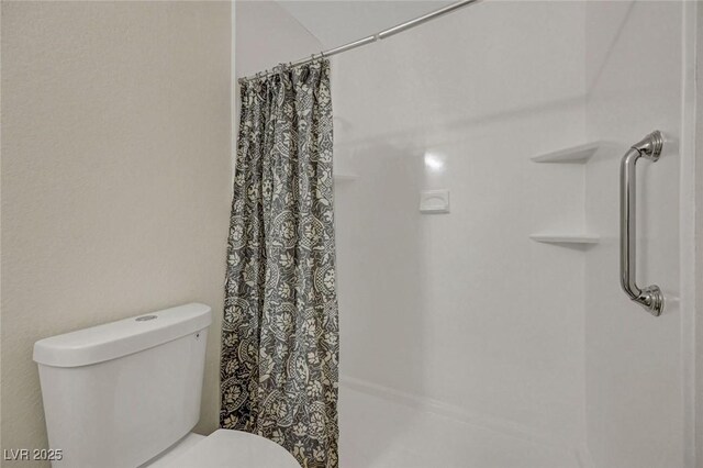 5161 Lindell Rd Unit 206, Las Vegas, NV 89118 - full bath with a shower with shower curtain and toilet
