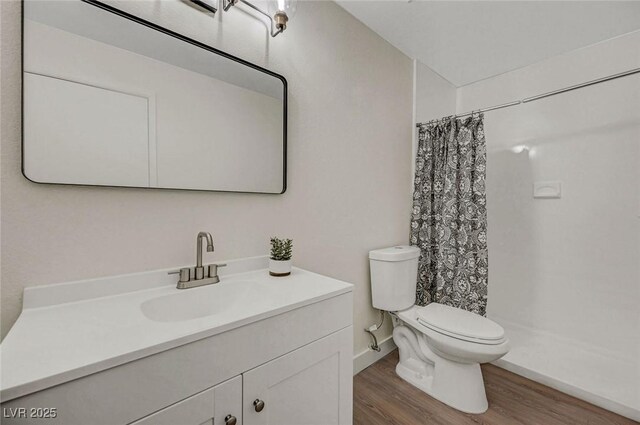 5161 Lindell Rd Unit 206, Las Vegas, NV 89118 - bathroom featuring wood finished floors, vanity, and a shower with curtain