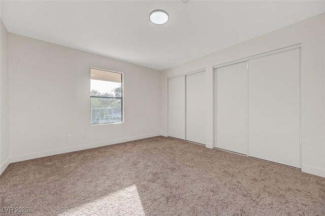 5161 Lindell Rd Unit 206, Las Vegas, NV 89118 - unfurnished bedroom with two closets and carpet