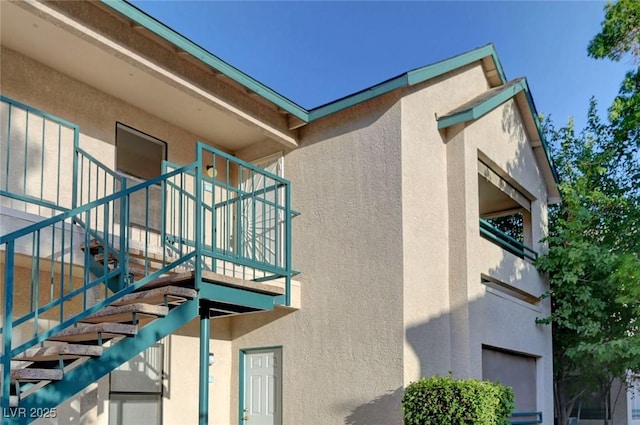 5161 Lindell Rd Unit 206, Las Vegas, NV 89118 - view of side of property featuring stucco siding and stairway